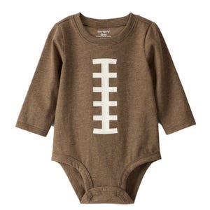 Brown onesie with long sleeves resembling a football, featuring vertical white laces on the front. Designed for infants, size 6 months.
