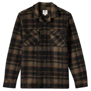 A brown and black plaid button-up shirt with a collar and two chest pockets.