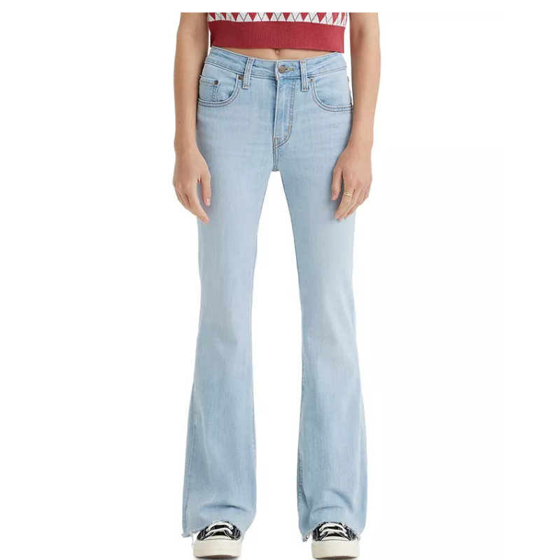 Light blue denim flare jeans with a high-waisted fit, classic five-pocket design, button and zipper closure, and slight distressed hem, paired with black-and-white sneakers.