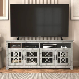 A flat-screen TV mounted on a wooden TV stand with decorative glass doors and electronic devices on the shelves.