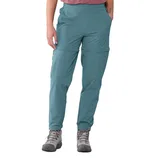 A person is wearing blue zip-off hiking pants and gray hiking boots, paired with a red shirt.