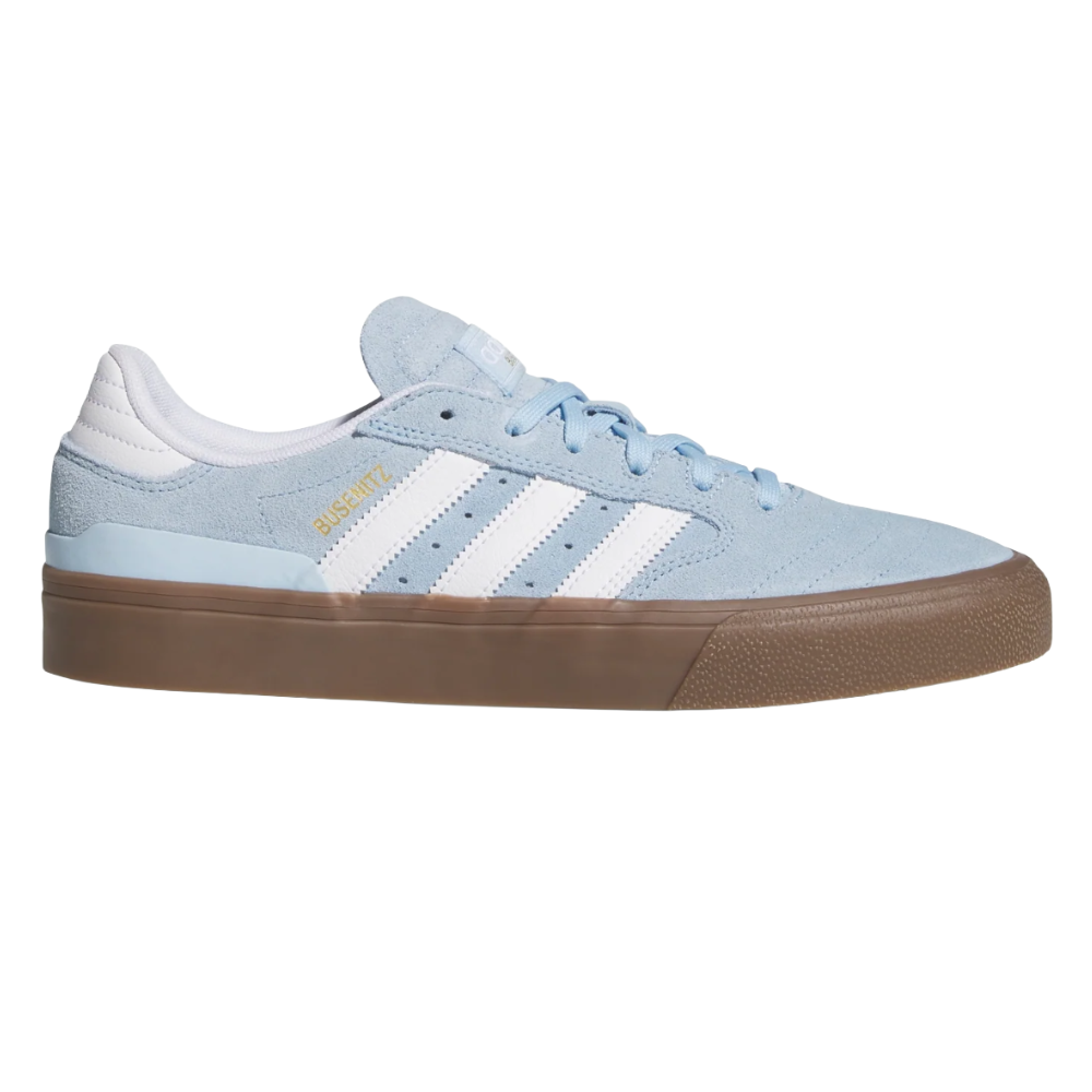 Light blue Adidas skate shoe with white stripes, gold \“BUSENITZ\“ text, and a brown rubber sole.