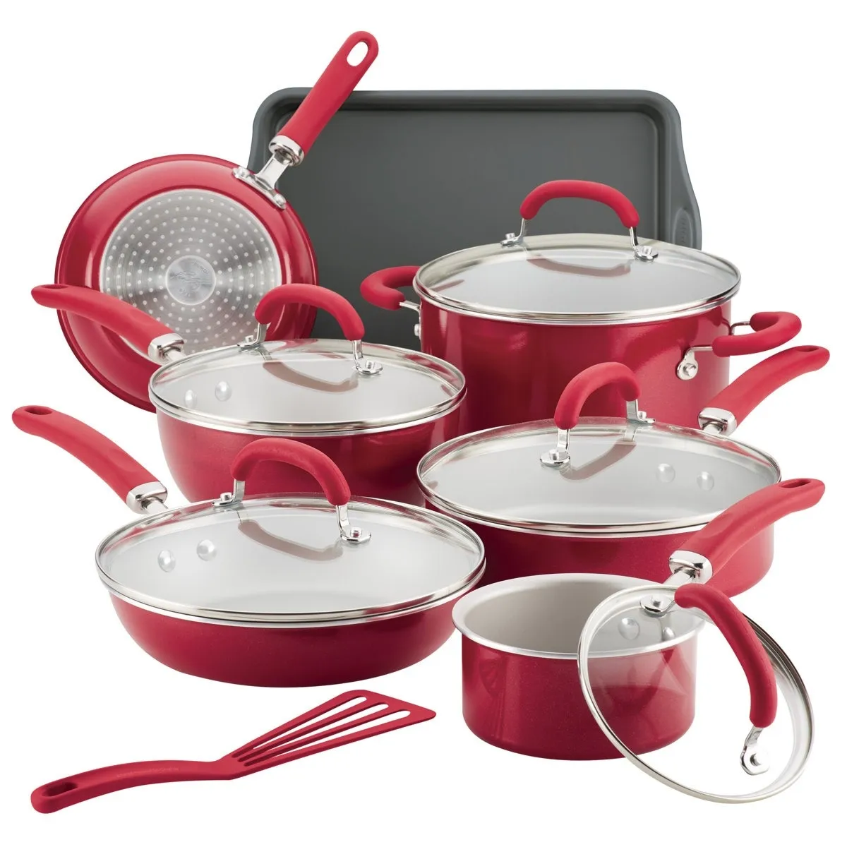 Red nonstick cookware set includes pots, pans, lids, a cookie sheet, and a spatula. The set features rubberized handles and glass lids, designed for various cooking needs.