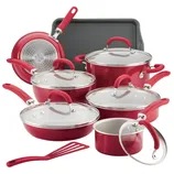 Red nonstick cookware set includes pots, pans, lids, a cookie sheet, and a spatula. The set features rubberized handles and glass lids, designed for various cooking needs.