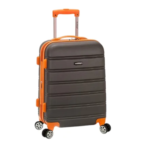 A charcoal gray hardshell suitcase with orange accents, features a telescopic handle and four multidirectional spinner wheels.