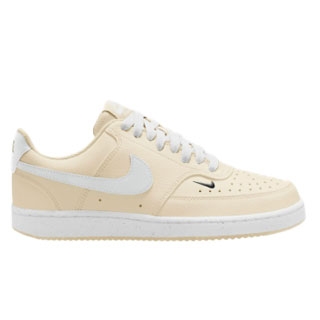 Cream-colored low-top sneaker with white laces and accents, featuring a small black swoosh logo on the side and a white sole.