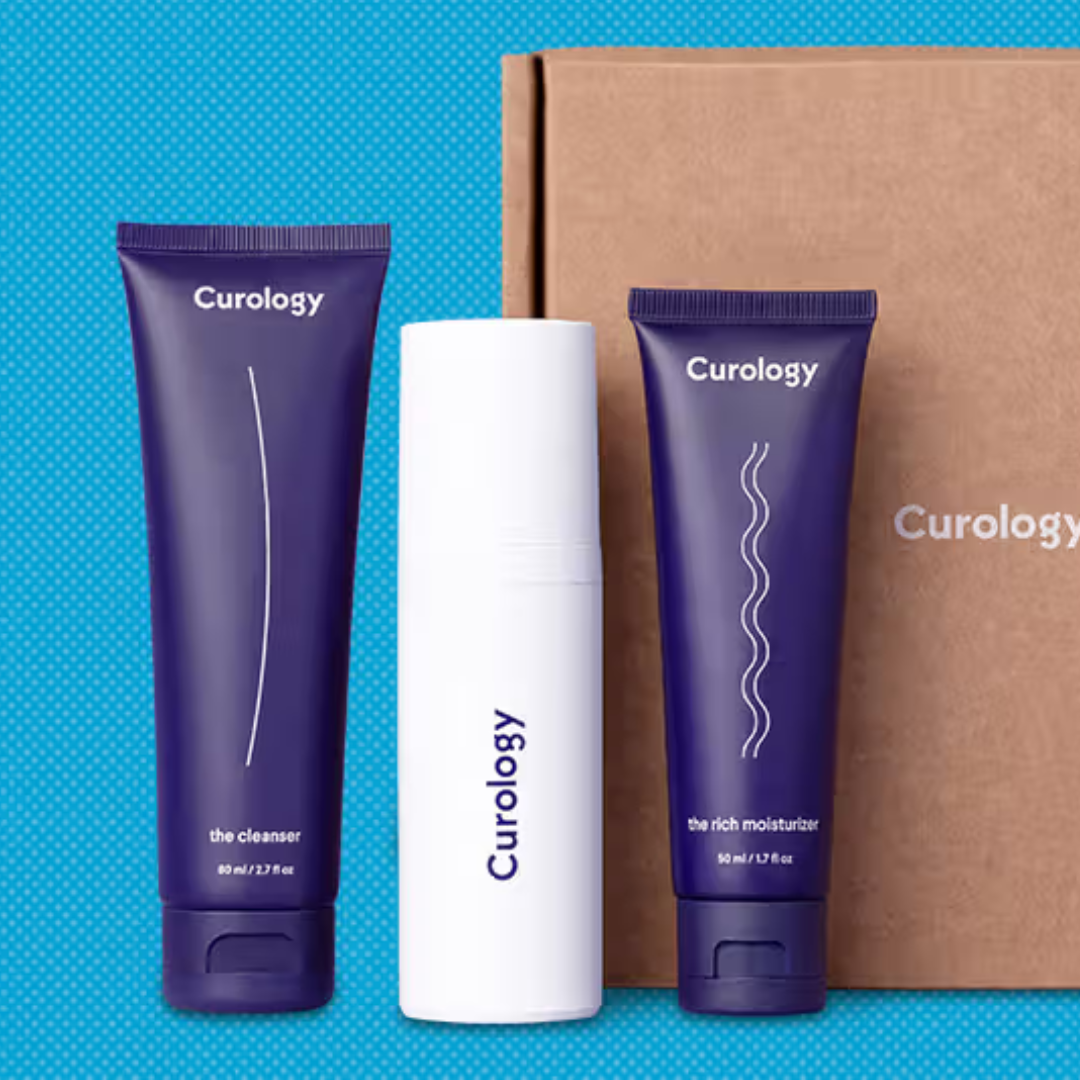 Curology skincare set with a cleanser (80 mL), a custom formula in a white bottle, and a rich moisturizer (50 mL), alongside branded packaging.