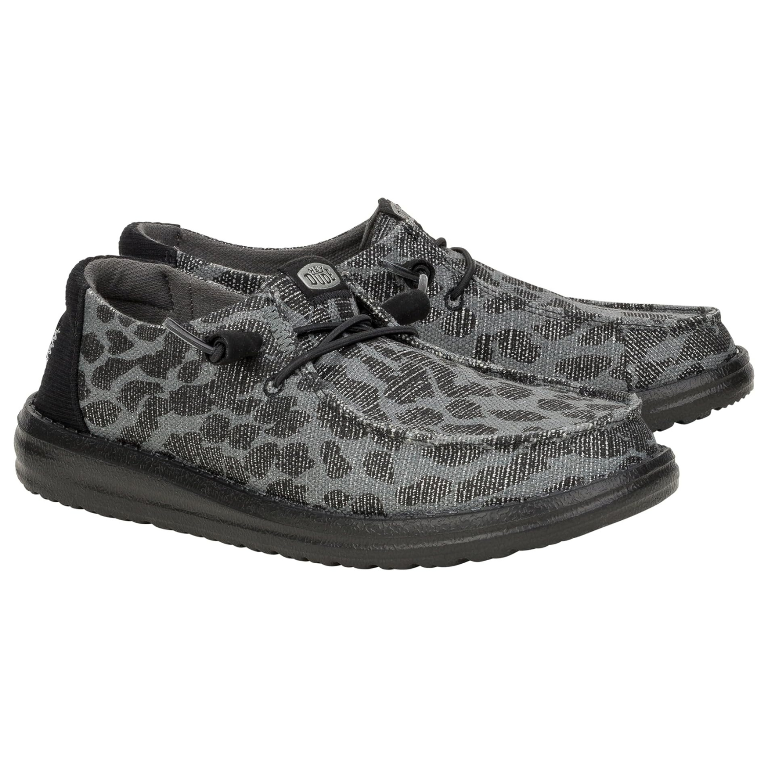 Hey Dude Wendy Leopard Sparkle Shoes are casual, slip-on shoes with a black and gray leopard print pattern and black laces, featuring a lightweight and comfortable design with a textured sole.