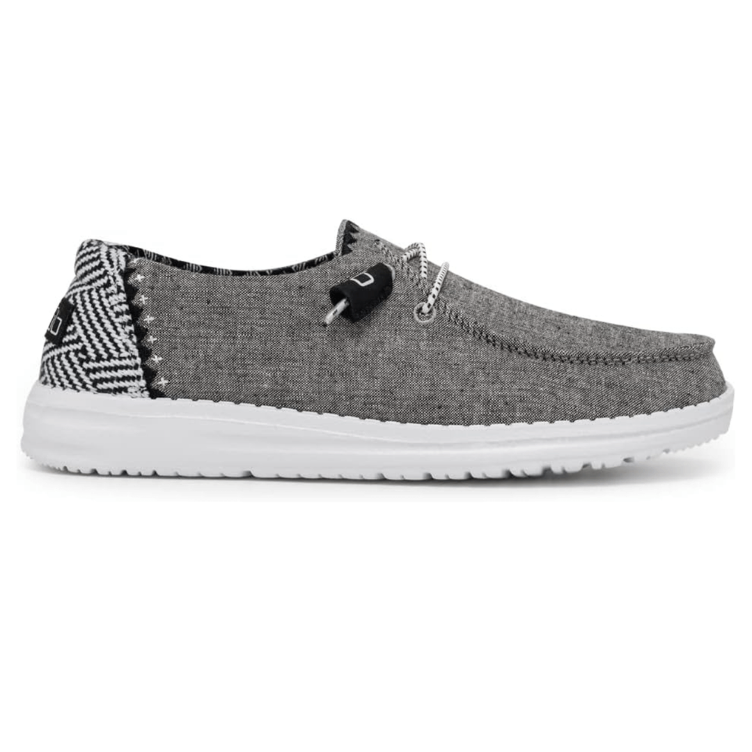 Casual slip-on shoe with a gray fabric upper, white sole, and patterned heel detail in black and white. Features a lace-up design with black and white accents.