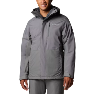 A man wearing a gray Columbia jacket with a hood, featuring a zippered chest pocket and subtle logo on the chest.