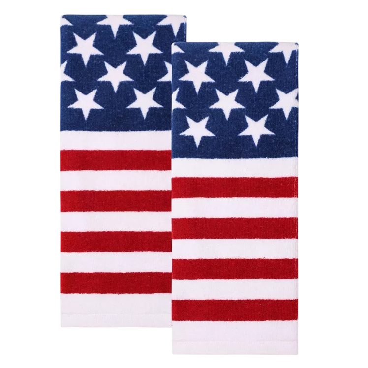 Two kitchen towels with an American flag design featuring blue with white stars and red and white stripes.