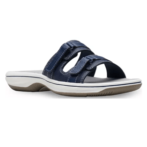 Navy blue slide sandal with two adjustable straps and a white and brown sole.