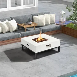 Outdoor patio setup with a gray cushioned L-shaped sofa, white fire pit table with black legs and built-in handle, and a small wooden tray table.
