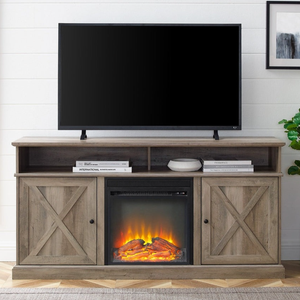 A brown wooden TV stand with farmhouse-style doors features an electric fireplace insert, a flat-screen TV on top, and shelves with books and decor items.