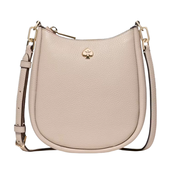 A beige leather crossbody bag with a gold spade logo, featuring an adjustable strap and gold hardware.