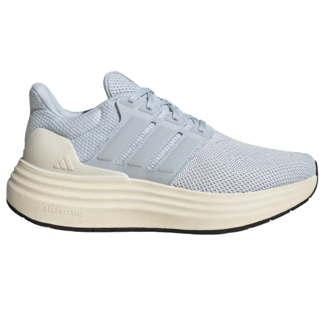 A light gray mesh sneaker with a cushioned cream midsole and black outsole, featuring three stripe overlays on the side.