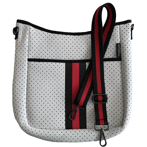 A white perforated crossbody bag with black and red stripes and a matching adjustable shoulder strap.