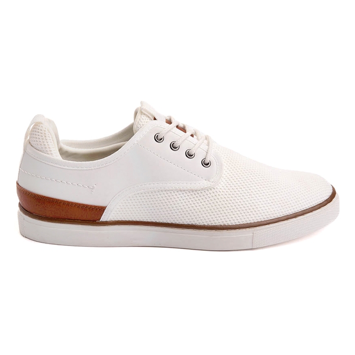 A white sneaker with brown leather accents and white laces.