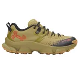 Tan Under Armour sneaker with black and orange accents, featuring a rugged sole for outdoor activities.