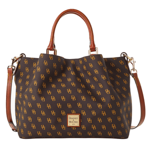 The Dooney & Bourke Gretta Satchel features a brown background with gold \“DB\“ monogram pattern, leather handles, and a detachable strap. It includes a prominent logo plaque on the front and gold-tone hardware.