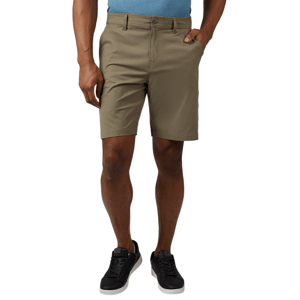 A person wearing khaki shorts paired with black sneakers and a light blue shirt.