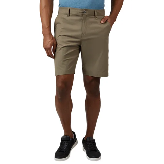 A person wearing khaki shorts paired with black sneakers and a light blue shirt.