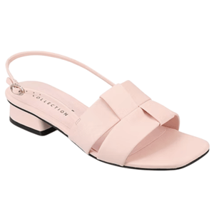 A pastel pink sandal with a low block heel, open toe, and slingback strap. It features a crisscross front design with a subtle bow accent.