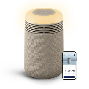A cylindrical smart air purifier with a fabric finish and a digital display on top, paired with a smartphone app interface showing time settings.