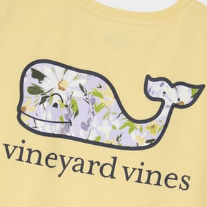 Yellow T-shirt with a floral whale design and the Vineyard Vines logo.