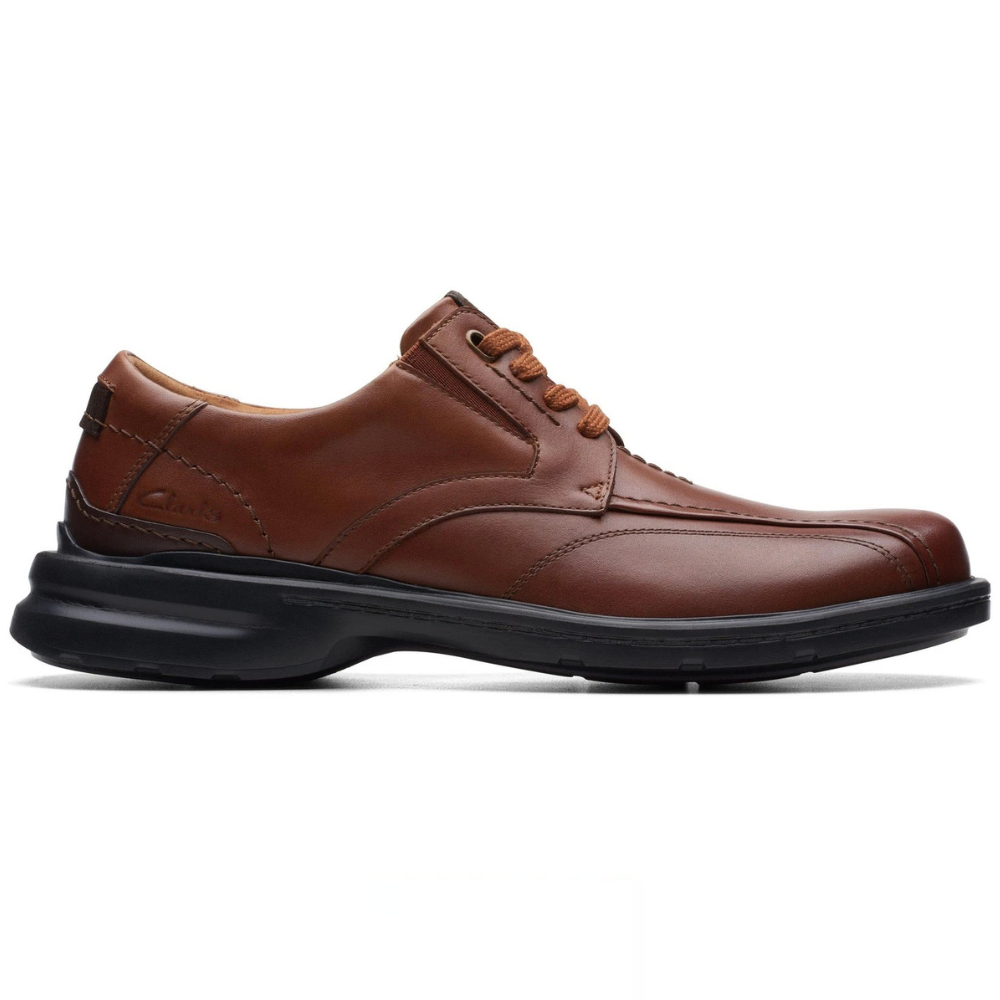Brown leather lace-up shoe with a black rubber sole, featuring detailed stitching and a comfortable design, suitable for formal or casual wear.