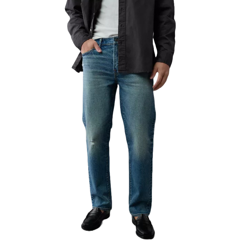 AE Men's Straight Jeans feature a classic straight-leg design in medium blue denim with a slightly faded finish. They're paired with a black shirt and black loafers, offering a casual and versatile look.