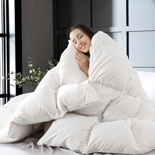 A woman is hugging a large, fluffy white king-size feather-down comforter, which looks soft and cozy.