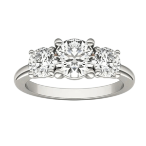 A three-stone engagement ring with a white metal band, featuring three round-cut diamonds in a classic setting.