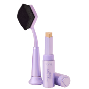 Tarte Cosmetics Concealer Duo includes a stick concealer and a unique hexagon-shaped blending brush, both in a light purple color. The concealer stick is labeled \“shape tape BLUR.\“