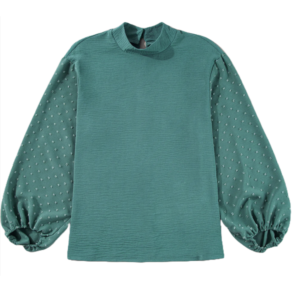 Green blouse with long, puffed sleeves featuring a Swiss dot pattern and a simple round neckline.