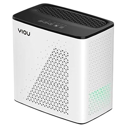 A rectangular air purifier with a white body, black top, and triangular perforations on the sides and front, featuring a control panel on the top surface.