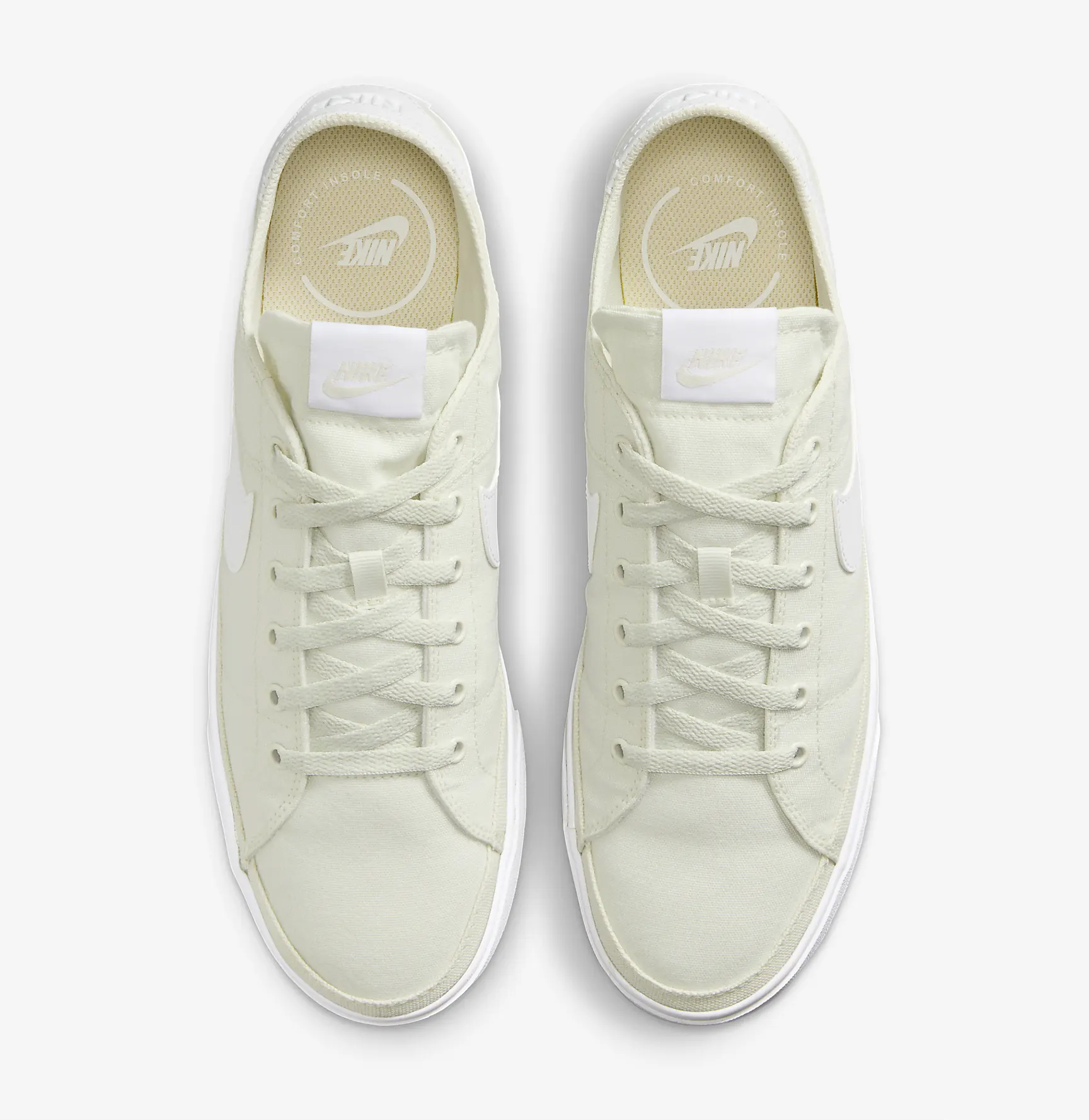 A pair of off-white sneakers with white laces and branding on the tongue and insole.