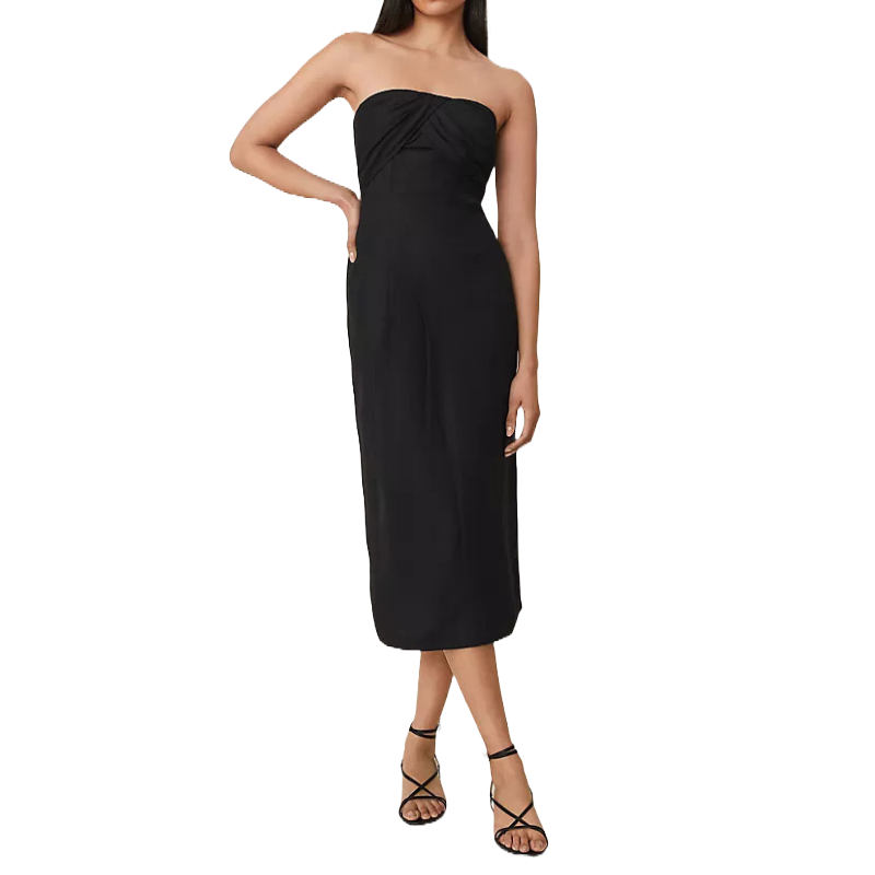 A black strapless linen blend midi dress featuring a fitted bodice with subtle twist detailing at the top, paired with simple black strappy sandals.