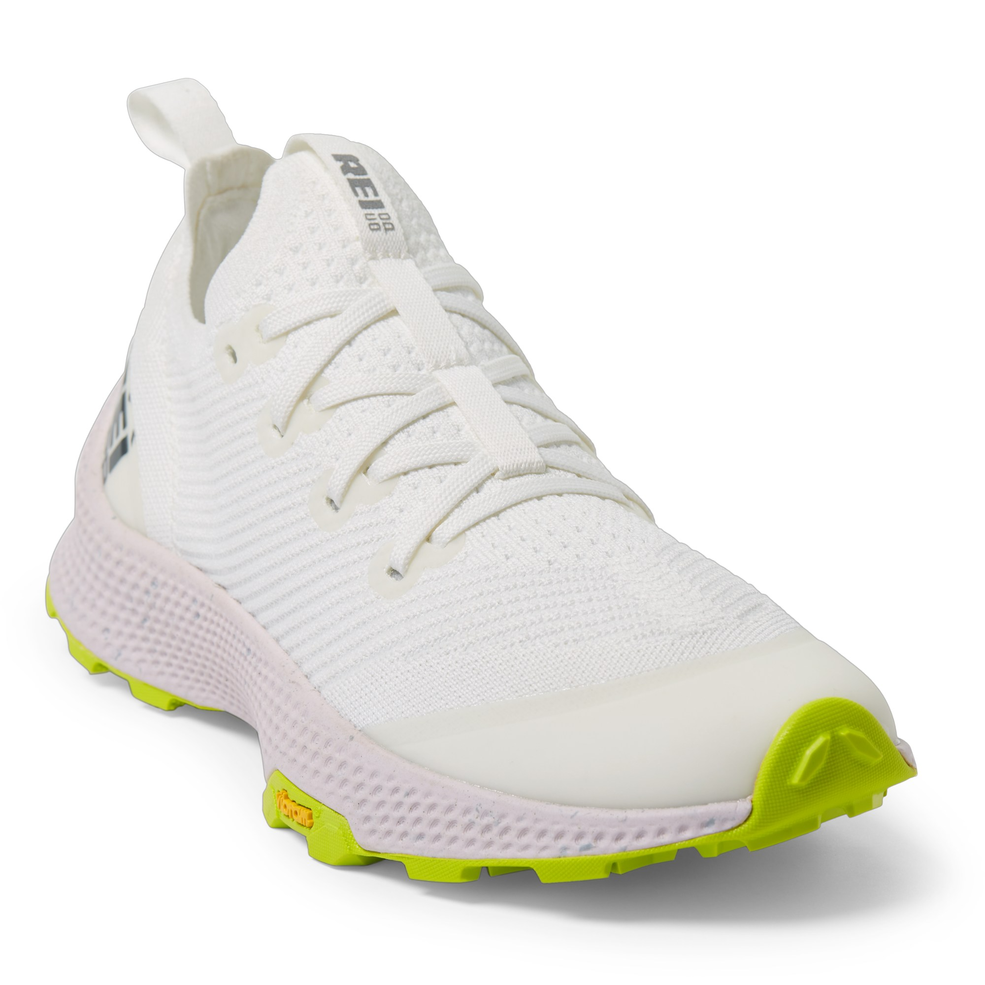 White and lime green running shoe with breathable mesh upper and a pull loop on the heel.