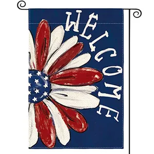 Garden flag featuring a red, white, and blue flower with stars, and the word \“Welcome\“ on a blue background.