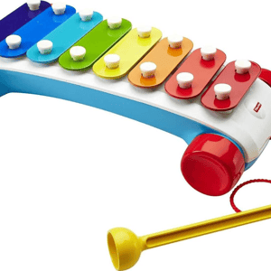 A colorful children's xylophone with a curved design, featuring eight rainbow-colored keys, a yellow mallet, red wheels, and a pull string.