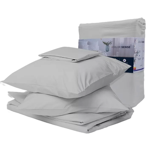 A cotton-blend sateen sheet set in light gray includes pillowcases, a flat sheet, and a fitted sheet. The set is neatly folded and packaged, showcasing its smooth and soft texture.