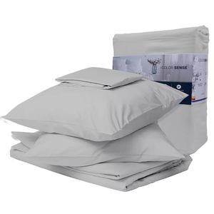 A cotton-blend sateen sheet set in light gray includes pillowcases, a flat sheet, and a fitted sheet. The set is neatly folded and packaged, showcasing its smooth and soft texture.