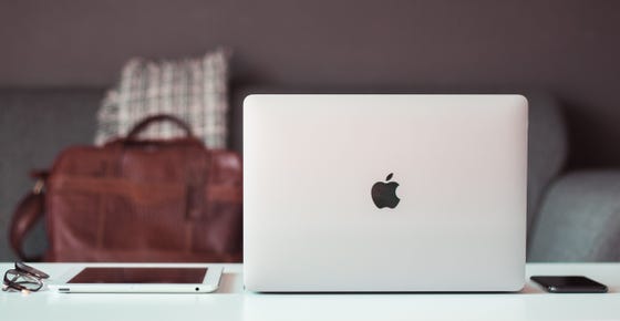 Macbook and Apple products on desk