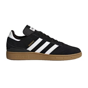 The Adidas Busenitz Pro Shoes feature a black suede upper with white stripes, gold \“Busenitz\“ branding, and a gum sole. They are designed for skateboarding, combining style and functionality.