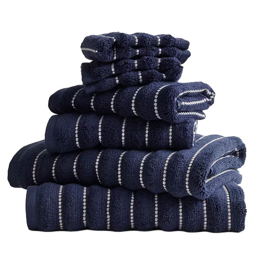 A stack of navy blue towels with white stripes in various sizes, neatly folded.