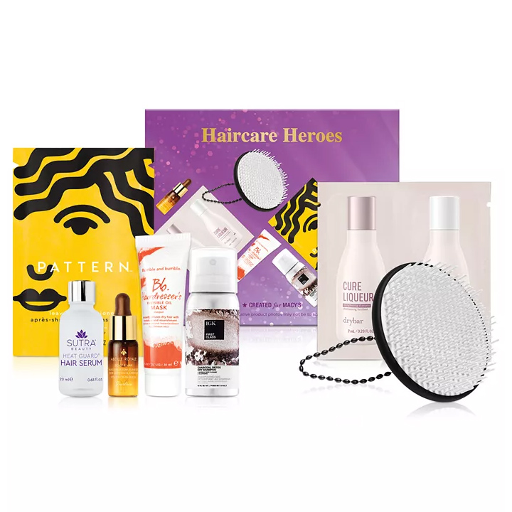 The Macy's Hair Care Heroes Set includes 7 items: Pattern leave-in conditioner, Sutra heat guard hair serum, Bumble and Bumble hairdresser's mask, K18 repair mask, Oribe gold lust oil, Drybar Cure Liqueur shampoo and conditioner, and a detangling brush.
