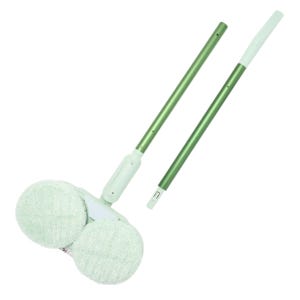A green and white electric mop with dual rotating pads, featuring a removable handle for easy storage.