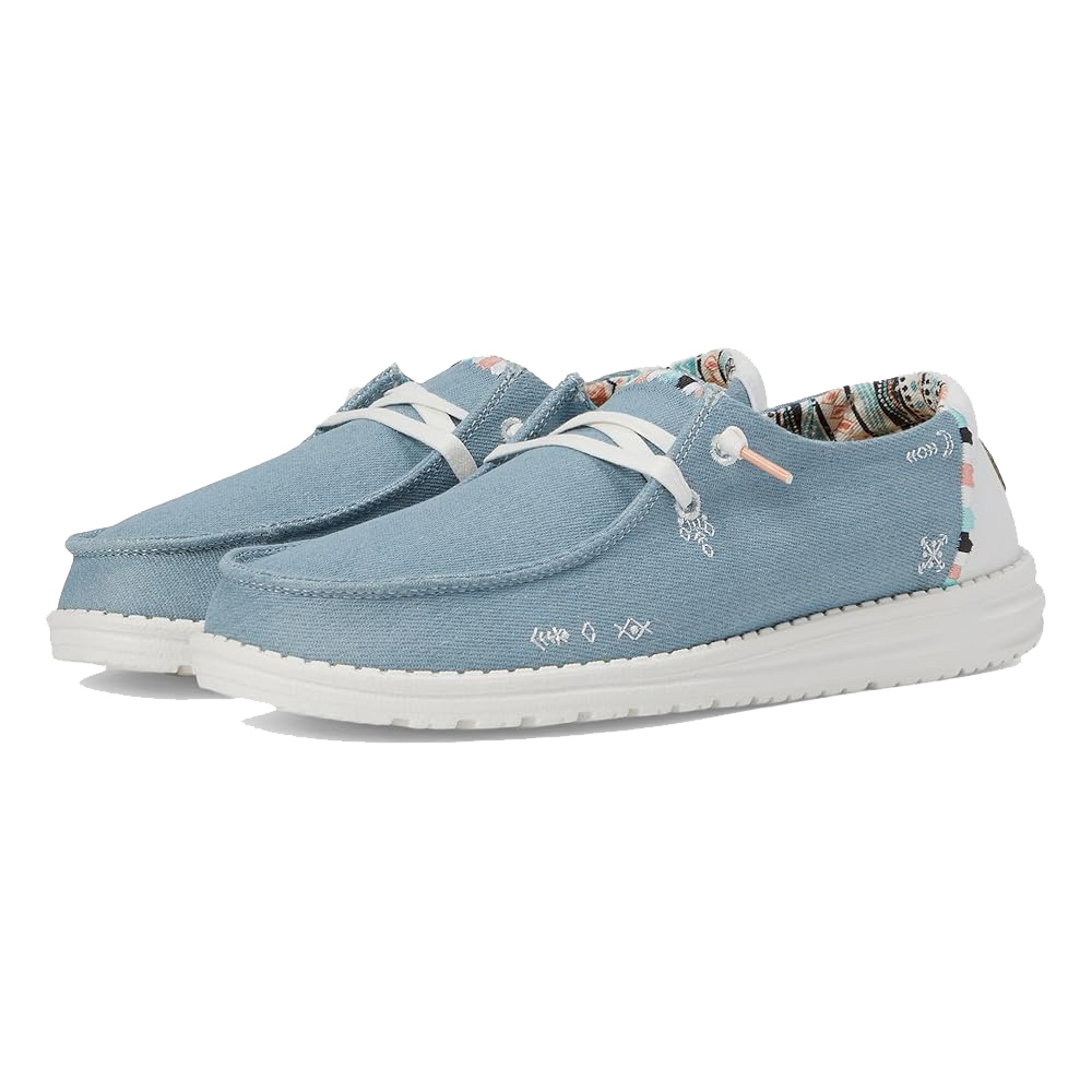 Light blue Hey Dude Wendy Boho shoes with white laces, featuring a bohemian print inner lining and a white sole.