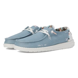 Light blue Hey Dude Wendy Boho shoes with white laces, featuring a bohemian print inner lining and a white sole.
